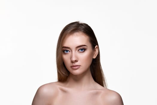 beautiful young woman with perfect skin on white background
