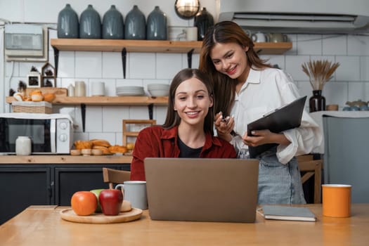 Two girls watching laptop. Watch Video Play social media, vacation getaway.