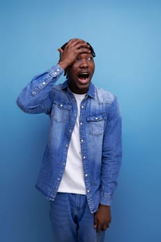 charismatic stylish african man with black dreadlocks screwed.