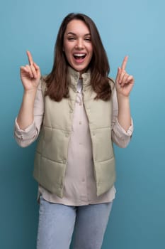 joyful successful brunette young woman in casual look looks up.