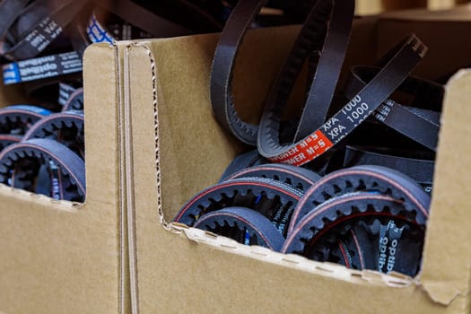 Toothed drive belt for a compressor in a box in stock. Close-up. High quality photo