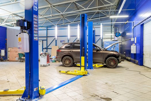 Hydraulic lift for cars in the workshop. High quality photo