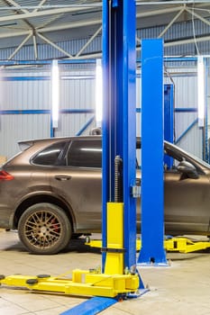 Hydraulic lift for cars in the workshop. High quality photo