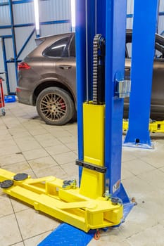 Hydraulic lift for cars in the workshop. High quality photo