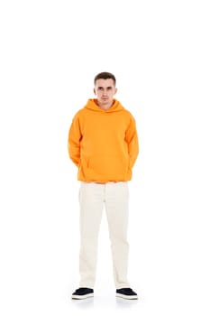 thoughtful young man in blank sweatshirt with space for your logo or design on white background. . Full length