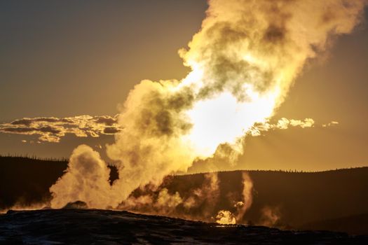 Sunset of Old Faithful in Yellowstone National Park