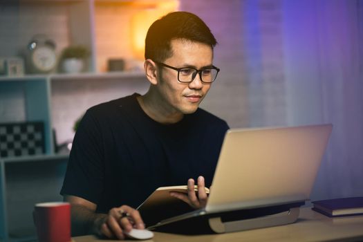 freelancer man working with laptop on the table, work from home concept