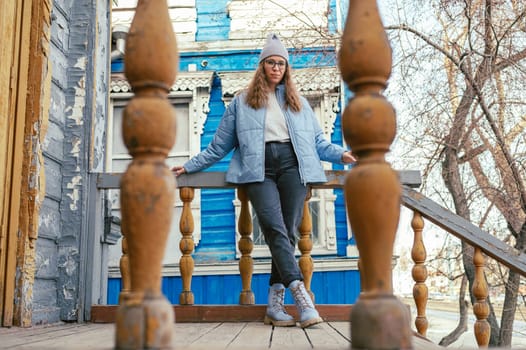 Portrait of a stylish woman in blue jacket. Spring outdoor portrait.