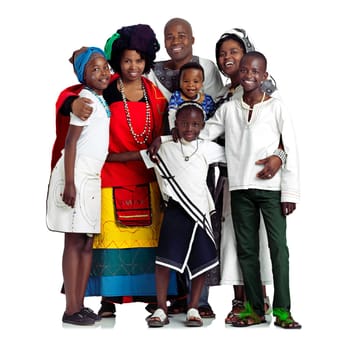Raising them the traditional way. Studio shot of a traditional african family isolated on white