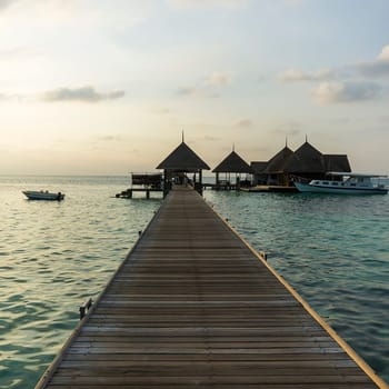Pier in a resort in maldives island, indian ocean