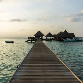Pier in a resort in maldives island, indian ocean