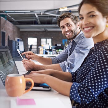 Teamwork, technology and portrait of businessman and woman at desk with laptop at creative agency working on web project together. Collaboration, happy employees or business people at design startup