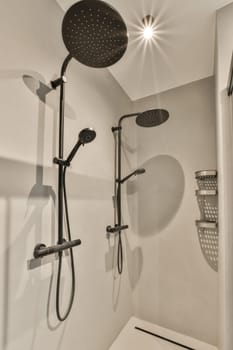 a modern bathroom with shower head and hand held shower fauced on the wall in black and white colors