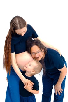 beautiful european happy family with a pregnant mother, the father and a son together. High quality photo