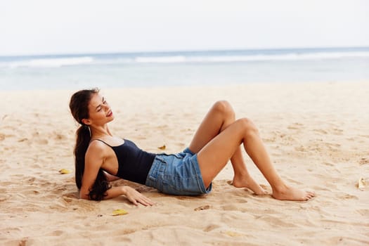 woman back attractive happy body girl sitting fashion smile beach freedom sea beauty carefree hair alone model vacation sand nature travel view