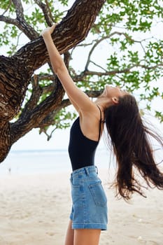 woman sky paradise sunset palm sea lifestyle model hat vacation relaxation tree long hair sitting nature holiday playing smiling freedom hanging relax