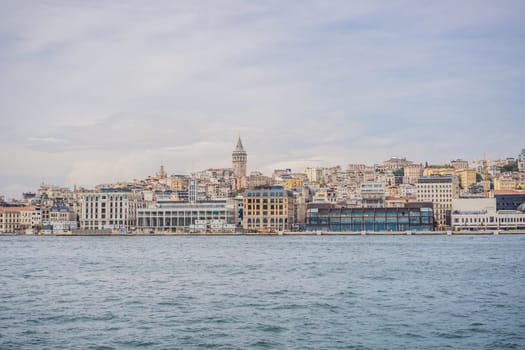 Istanbul city skyline in Turkey, Beyoglu district old houses with Galata tower on top, view from the Golden Horn.