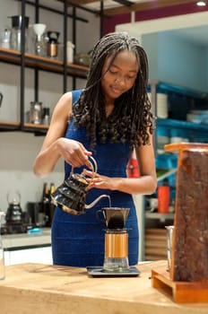 young afro girl prepares a coffee in a cafeteria dressed very elegantly. High quality photo