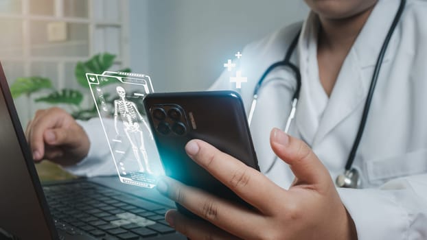 Doctors use smartphones and computers to research medical information. medical concept