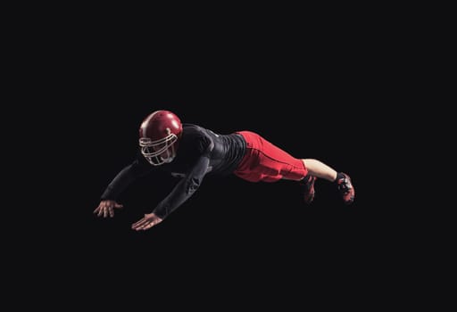 Soccer player on a dark background in vintage style. The classic American game. college Students. It makes the jump