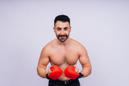 Young caucasian handsome man isolated on a white background with boxing gloves