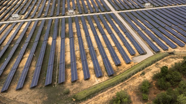 Top view on photovoltaic solar power panels. Drone aerial view of Solar panels system power generators from sun. Alternative Energy Sources - The Concept of Sustainable Resources.