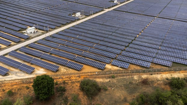 Top view on photovoltaic solar power panels. Drone aerial view of Solar panels system power generators from sun. Alternative Energy Sources - The Concept of Sustainable Resources.