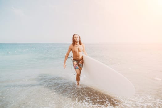 Asian man swimming in sea water and paddleboarding passing beautiful sea at summer sunset. Healthy strong male enjoy outdoor active lifestyle and water sports on holiday vacation