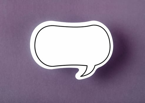 Speech bubble with copy space communication talking speaking concepts on purple background.