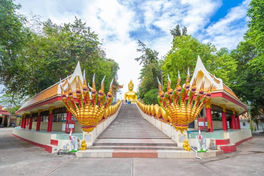 Golden Big Buddha with blue sky in Pattaya, Thailand in a summer day