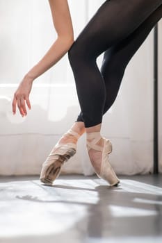 Close-up of the legs and arms of a ballerina