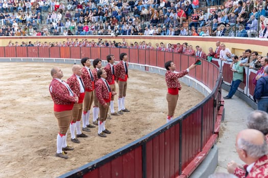 March 26, 2023 Lisbon, Portugal: Tourada - forcado team stand in a row on arena. Mid shot