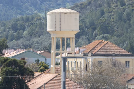 A water tower in a European town. Mid shot