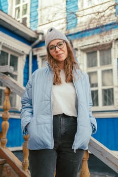 Portrait of a stylish woman in blue jacket. Spring outdoor portrait.