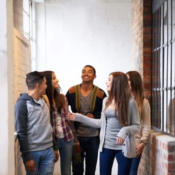 Friends laugh, university hallway and people talking with happiness and discussion together. Teenager, college and school communication of young and gen z students on campus for education and class.