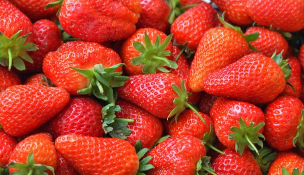 Background of an appetizing ripe large strawberries