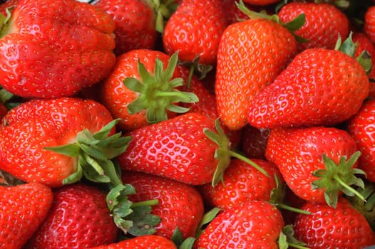 Background of an appetizing ripe large strawberries