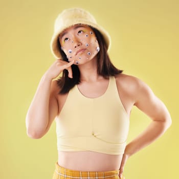 Eyes, thinking and woman with a hand call isolated on a yellow background in a studio. Idea, fashion and Asian girl with fingers in a telephone gesture for communication, conversation and talking.