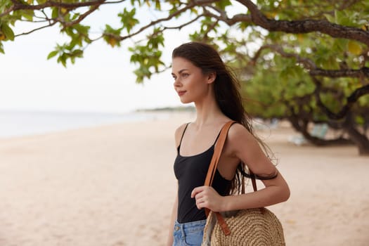 shore woman peaceful lifestyle sunlight free smile young beach nature water coast girl caucasian ocean summer vacation carefree sea freedom sand