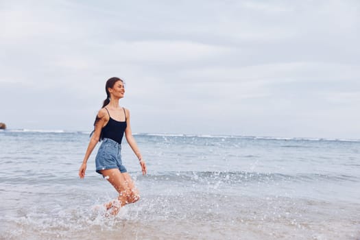 woman hair leisure travel happy wave girl sea lifestyle young smile running fun beach sunset shore sexy activity beautiful summer walking