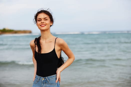 caucasian woman summer coast smile sunset space peaceful freedom relax sand holiday vacation sea copy walking lifestyle jean beach water dress ocean