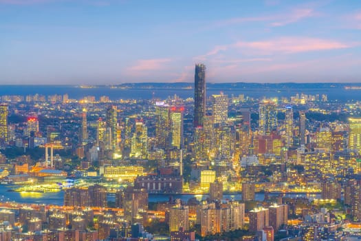 Cityscape of downtown Brooklyn skyline  from Manhattan New York City at sunset  