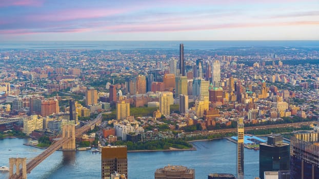 Cityscape of downtown Brooklyn skyline  from Manhattan New York City at sunset  