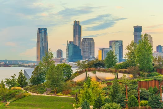 Cityscape of Jersey City skyline  from Manhattan New York City at sunrise