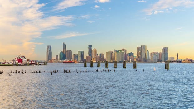 Cityscape of Jersey City skyline  from Manhattan New York City at sunrise