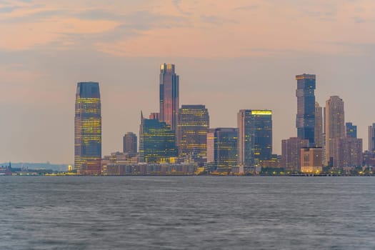 Cityscape of Jersey City skyline  from Manhattan New York City at sunset  