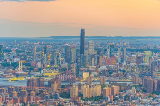 Cityscape of downtown Brooklyn skyline  from Manhattan New York City at sunset  