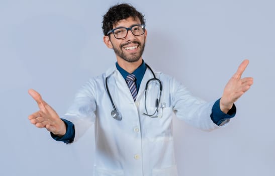 Doctor smiling with open arms welcoming. Friendly doctor hugging the camera. Medical friendship concept