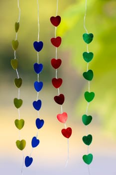 Colored shiny hearts hanging garland for Valentine's Day