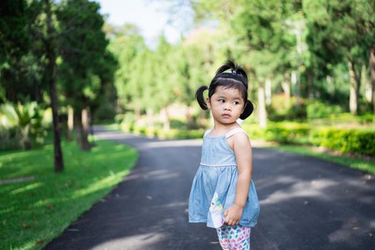 Cute baby playing at the garden